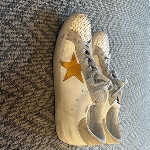 Golden Goose women’s White and Gold Star Sneakers